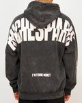 Back view of a men’s oversized washed black hoodie featuring a large Riches Paris back print and “I’M FOUND MONEY” text.