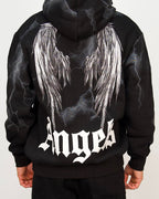 Back view of a men’s oversized black hoodie with illustrated angel wings and lightning-style graphic detailing.