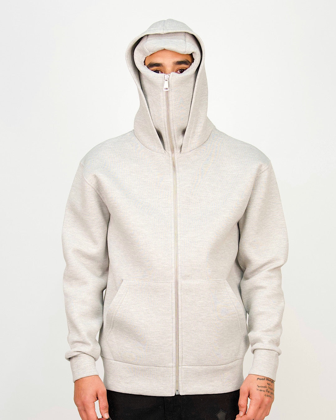 Front view of a men’s regular-fit grey hoodie featuring a full-zip integrated mask and kangaroo pocket.