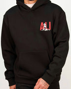 Front view of a men’s regular-fit black hoodie featuring a bold red “ALI” graphic with a boxer silhouette.