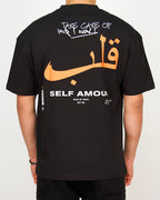 Back view of a men’s regular-fit black T-shirt with bold Arabic lettering and layered motivational text.