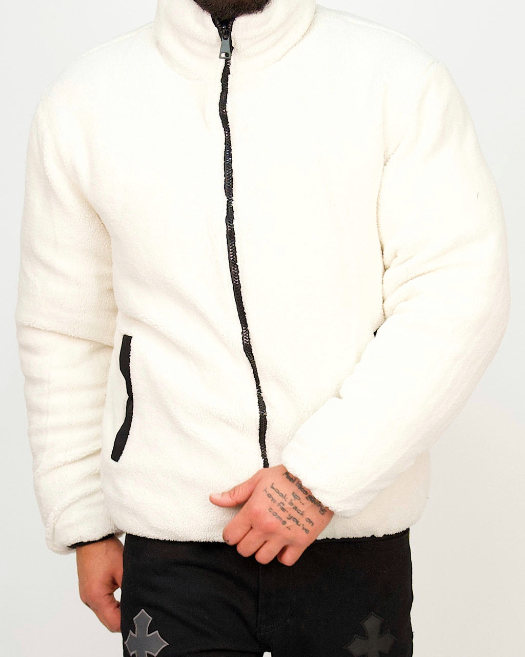 Front view of a men’s regular-fit reversible zip puffer jacket shown in beige, with a black faux-shearling inner side.