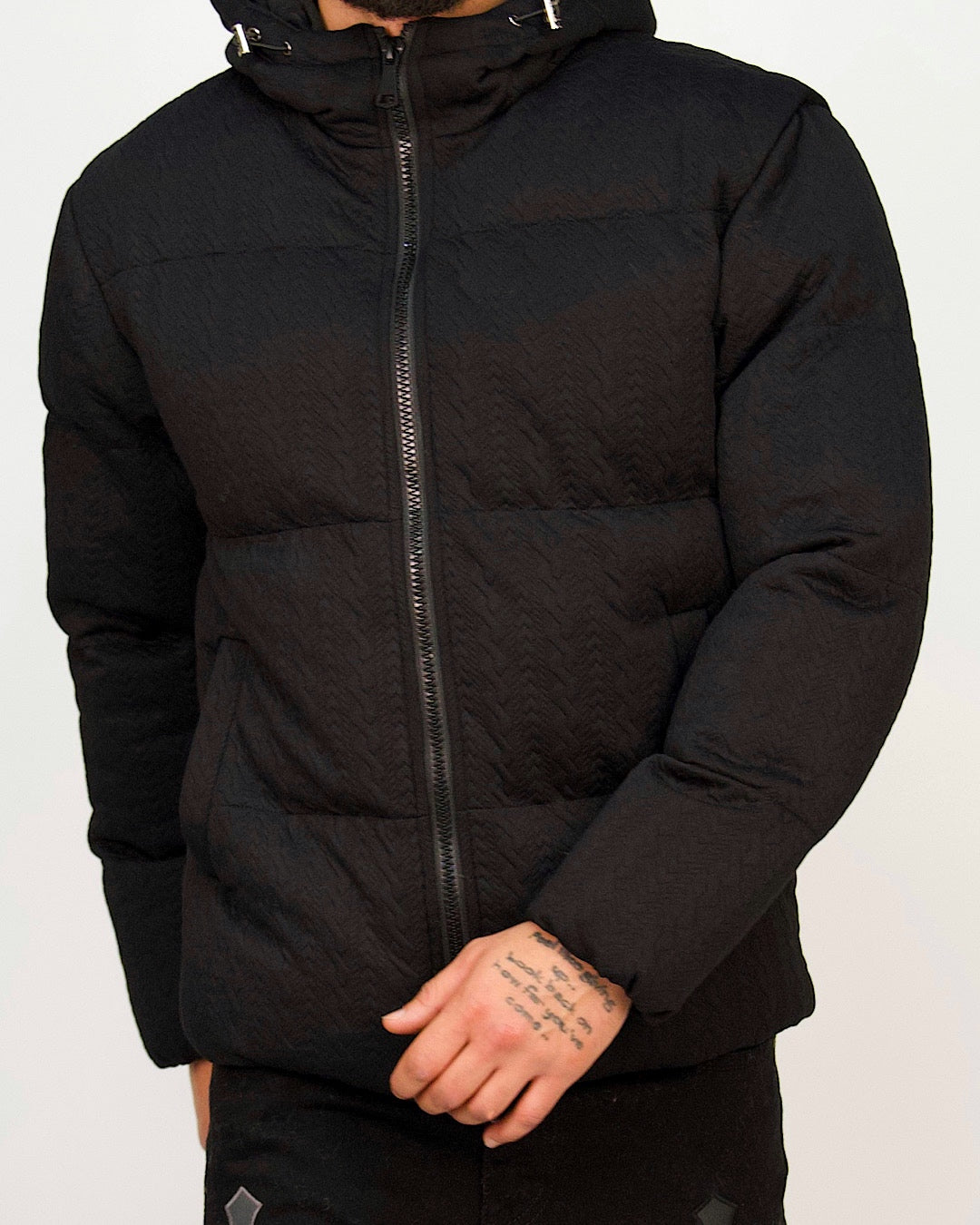 Men’s black textured-weave hooded puffer jacket with zip fastening and padded construction.