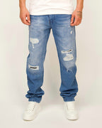 Blue straight-leg jeans with ripped panels and paint-splatter detailing.