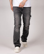Washed Grey Flared Jeans With Raw Hem And Vintage Fade