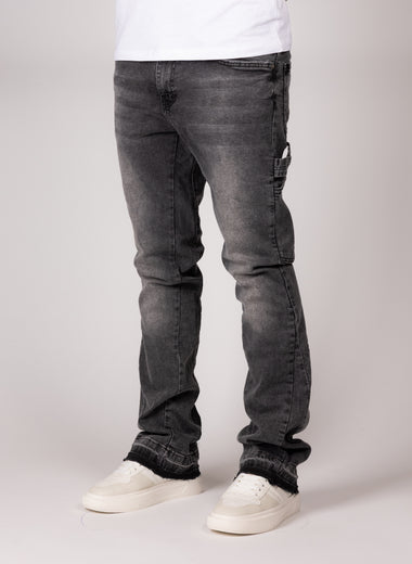 Washed Grey Flared Jeans With Raw Hem And Vintage Fade