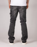 Washed Grey Flared Jeans With Raw Hem And Vintage Fade