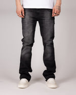 Washed Black Flared Jeans With Distressed Details