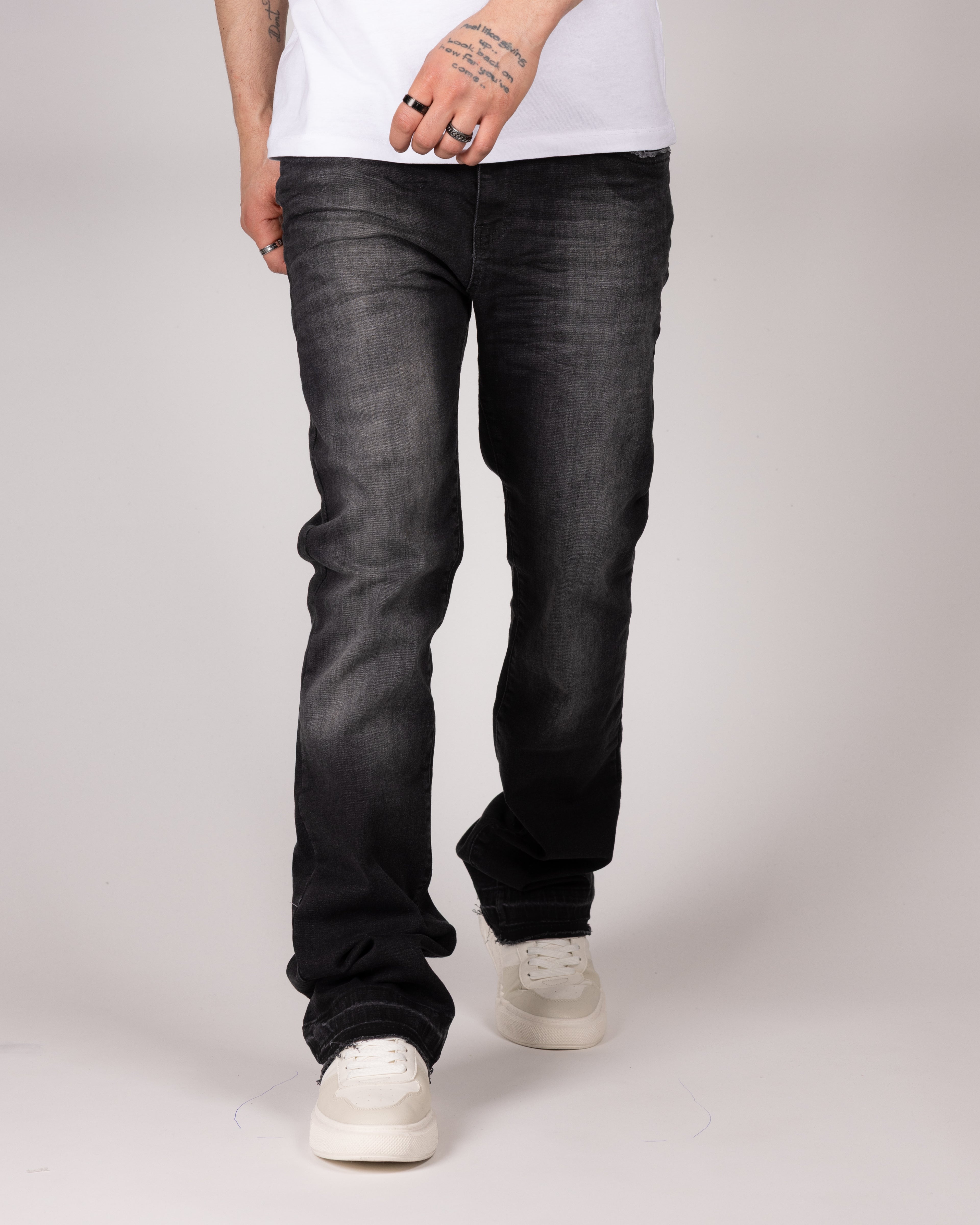 Washed Black Flared Jeans With Distressed Details